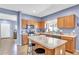 Well-equipped kitchen with stainless steel appliances, a center island, and ample counter space at 2865 E Cathy Dr, Gilbert, AZ 85296