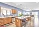 Spacious kitchen with a breakfast bar, stainless steel dishwasher, and a view into the dining area at 2865 E Cathy Dr, Gilbert, AZ 85296