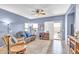 Relaxing living room featuring comfortable seating, a ceiling fan, and a sliding glass door for natural light at 2865 E Cathy Dr, Gilbert, AZ 85296