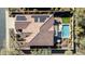 Stunning aerial shot featuring a well manicured roof, desert landscaping and swimming pool at 30696 N 130Th Ln, Peoria, AZ 85383