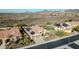 Expansive aerial view of the property with solar panels, showcasing the neighborhood and surrounding landscape at 30696 N 130Th Ln, Peoria, AZ 85383