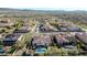 Community aerial view showcasing multiple homes, lush landscaping, and a sparkling pool and spa at 30696 N 130Th Ln, Peoria, AZ 85383
