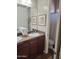 Bathroom featuring double sinks and granite counters at 30696 N 130Th Ln, Peoria, AZ 85383