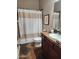 Bathroom with shower/tub combo, granite counters, and ample cabinet space at 30696 N 130Th Ln, Peoria, AZ 85383