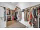 Spacious walk-in closet with ample hanging space and shelving for organized storage at 30696 N 130Th Ln, Peoria, AZ 85383