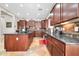 Kitchen featuring granite countertops, stainless steel appliances, large island and ample cabinet space at 30696 N 130Th Ln, Peoria, AZ 85383