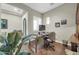 Comfortable home office with wood floors, built-in cabinets, and natural light at 30696 N 130Th Ln, Peoria, AZ 85383