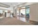 View of the patio and outdoor seating area, with open doorway from an open floorplan at 30696 N 130Th Ln, Peoria, AZ 85383