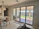 Sliding glass doors open to a backyard patio and grassy area at 39190 N Kaden Ln, San Tan Valley, AZ 85140