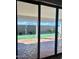 View of backyard through sliding glass doors from inside the home at 39190 N Kaden Ln, San Tan Valley, AZ 85140