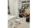 Bathroom with white vanity, floral shower curtain, and neutral tile at 39190 N Kaden Ln, San Tan Valley, AZ 85140