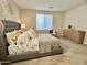 Spacious bedroom with plush bed and ample natural light at 39190 N Kaden Ln, San Tan Valley, AZ 85140