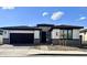 Single-story home with a two-car garage and landscaped front yard at 39190 N Kaden Ln, San Tan Valley, AZ 85140