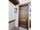 Modern dark brown front door with a sleek design at 39190 N Kaden Ln, San Tan Valley, AZ 85140