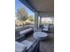 Covered patio with comfortable seating and a fire pit at 39190 N Kaden Ln, San Tan Valley, AZ 85140