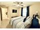Bedroom with a queen-size bed and built-in TV at 3937 S 79Th Ln, Phoenix, AZ 85043