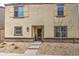 Charming front exterior featuring tan stucco and coordinated trim, gravel landscaping at 3937 S 79Th Ln, Phoenix, AZ 85043