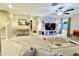 Spacious living room with a large TV, comfy seating, and a stylish rug at 3937 S 79Th Ln, Phoenix, AZ 85043