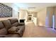 Loft area with comfortable seating and lighting at 3937 S 79Th Ln, Phoenix, AZ 85043