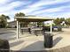 Covered picnic area with tables and trash receptacles at 43573 W Blazen Trl, Maricopa, AZ 85138