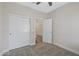 Bright bedroom with double doors and carpet flooring at 4741 E Tremaine Ave, Gilbert, AZ 85234