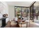 Dining room with round table and chairs with a window view to the surrounding mountains at 5000 N Camelback Ridge Dr # 107, Scottsdale, AZ 85251
