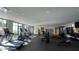 Well-equipped fitness center with treadmills, weights, and ample natural light at 5000 N Camelback Ridge Dr # 107, Scottsdale, AZ 85251