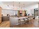 Modern kitchen with stainless steel appliances, custom cabinets, a large island and a breakfast bar at 5000 N Camelback Ridge Dr # 107, Scottsdale, AZ 85251