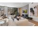 The living room has a fireplace with a stone hearth and a large sliding door that opens to a patio at 5000 N Camelback Ridge Dr # 107, Scottsdale, AZ 85251