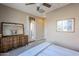 Bright bedroom with access to private patio and wooden dresser at 5457 W Corral Dr, Eloy, AZ 85131