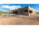 Desert backyard with mountain views, and a refreshing pool with umbrellas offers a great retreat at 5465 N Winchester Rd, Apache Junction, AZ 85119