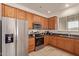 This kitchen features stainless steel appliances, tile floor and a bright window at 5465 N Winchester Rd, Apache Junction, AZ 85119