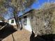 Side of house showing white walls and landscaping at 5920 W Palmaire Ave, Glendale, AZ 85301