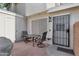 Cozy patio with a small table and chairs, perfect for relaxing at 625 S Westwood -- # 102, Mesa, AZ 85210