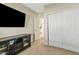 Bedroom with large closet and media console at 730 W El Alba Way, Chandler, AZ 85225