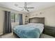 Spacious bedroom with ceiling fan and large bed at 730 W El Alba Way, Chandler, AZ 85225
