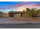 Single story home with attached garage and desert landscaping at 730 W El Alba Way, Chandler, AZ 85225