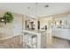 Island kitchen with white cabinets and granite countertops at 730 W El Alba Way, Chandler, AZ 85225