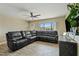 Spacious living room featuring a large sectional sofa and wood-look floors at 730 W El Alba Way, Chandler, AZ 85225