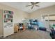 Home office features a desk, computer, and built-in shelving at 730 W El Alba Way, Chandler, AZ 85225