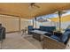 Covered patio with seating area and fire pit at 730 W El Alba Way, Chandler, AZ 85225