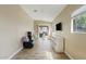Bright playroom with tile floors, backyard access, and built-in storage at 730 W El Alba Way, Chandler, AZ 85225