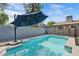 Inviting swimming pool with patio umbrella at 730 W El Alba Way, Chandler, AZ 85225
