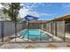 Sparkling pool with safety fence in a sunny backyard at 730 W El Alba Way, Chandler, AZ 85225