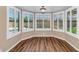 Dining room with wood flooring, bay windows, and plenty of natural light at 7331 W Aster Dr, Peoria, AZ 85381