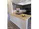 Well-lit kitchen featuring dark cabinets, granite countertops, and modern black appliances at 7331 W Aster Dr, Peoria, AZ 85381