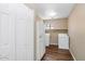 Laundry room with closet, window, washer, dryer and full-size refrigerator at 7331 W Aster Dr, Peoria, AZ 85381