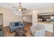 Cozy living room with wood floors, a kitchen bar, vaulted ceilings and comfortable seating at 7331 W Aster Dr, Peoria, AZ 85381