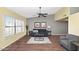 Bright living room featuring modern furnishings, neutral tones, and large windows with plantation shutters at 7331 W Aster Dr, Peoria, AZ 85381