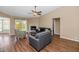 Comfortable living area features wood floors, vaulted ceiling, a fireplace, and lots of natural light at 7331 W Aster Dr, Peoria, AZ 85381